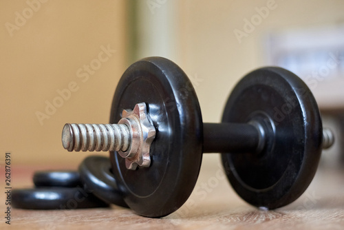 Dumbbell on the floor at home, home sports, healthy lifestyle