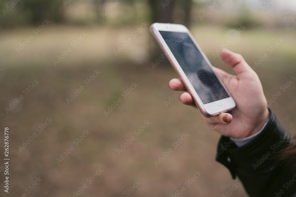Close up of woman use of mobile phone at outdoor. 