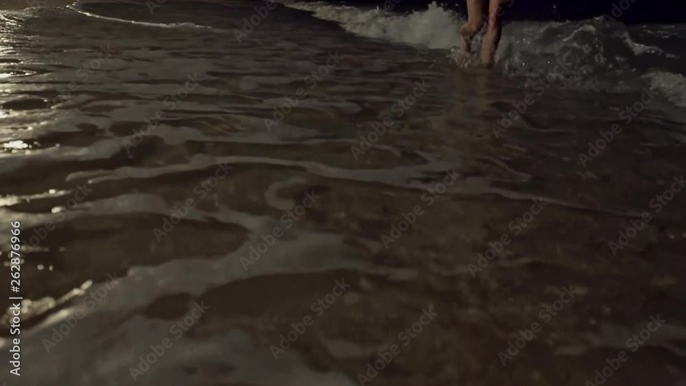 Gentle waves breaking on a sandy beach Gentle waves breaking on a sandy beach