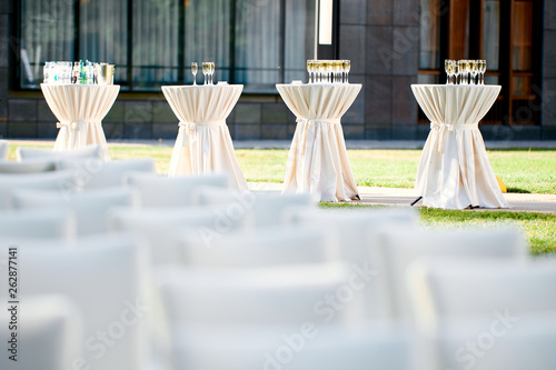 tables with drinks and champagne glasses in the open air