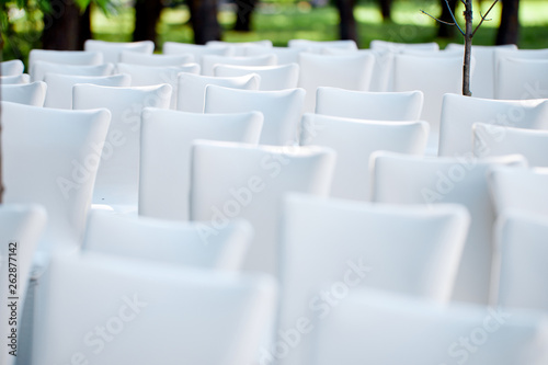 white chairs for outdoor check-in for guests