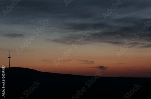 Fototapeta Naklejka Na Ścianę i Meble -  Silhouette signal antenna tower and the sun at sunset sky background