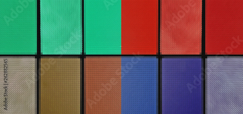 Different colored paint on a brick wall