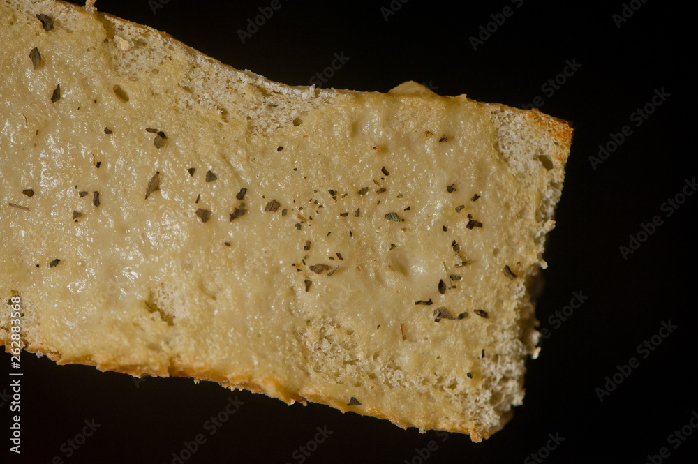 Slice of vegan oil-free garlic bread