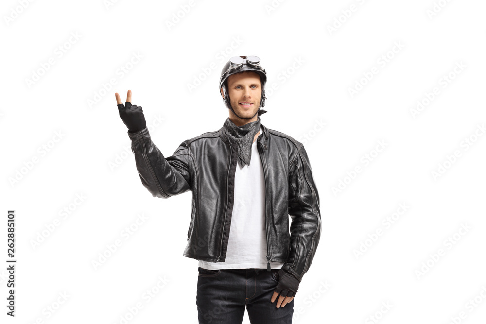 Young biker making a peace gesture Young biker making a peace gesture