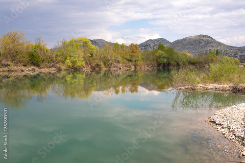 River Moraca landscape, clouds reflections in water. Montenegro photo