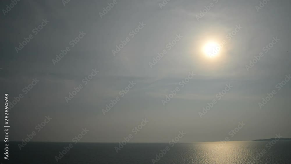 Sun shines over the sea creating reflection on water Sun shines over the sea creating reflection on water