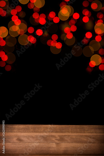 Wallpaper Mural Festive background with light spots and red bokeh. Wooden table in front view. Torontodigital.ca