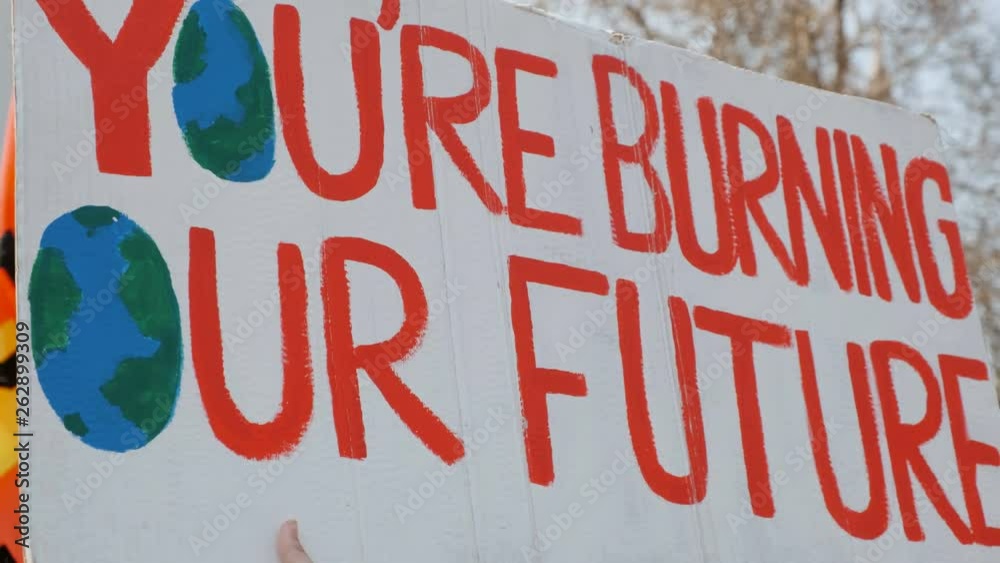 Extinction Rebellion poster to raise awareness to the dangers of Climate Change during a large demonstration in London, UK