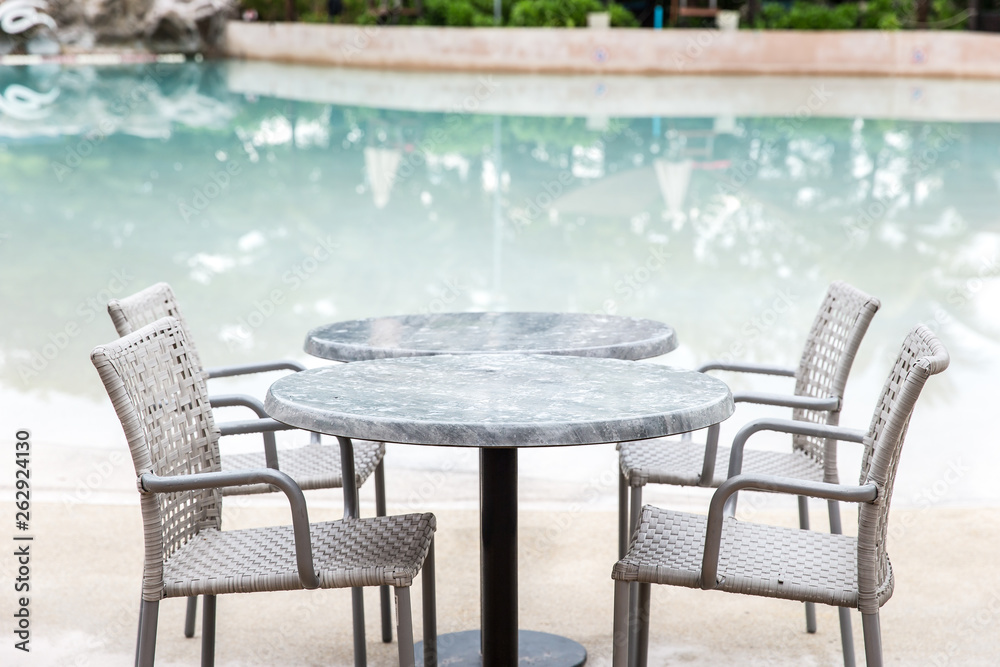 Chairs and Table with a part of swimming pool