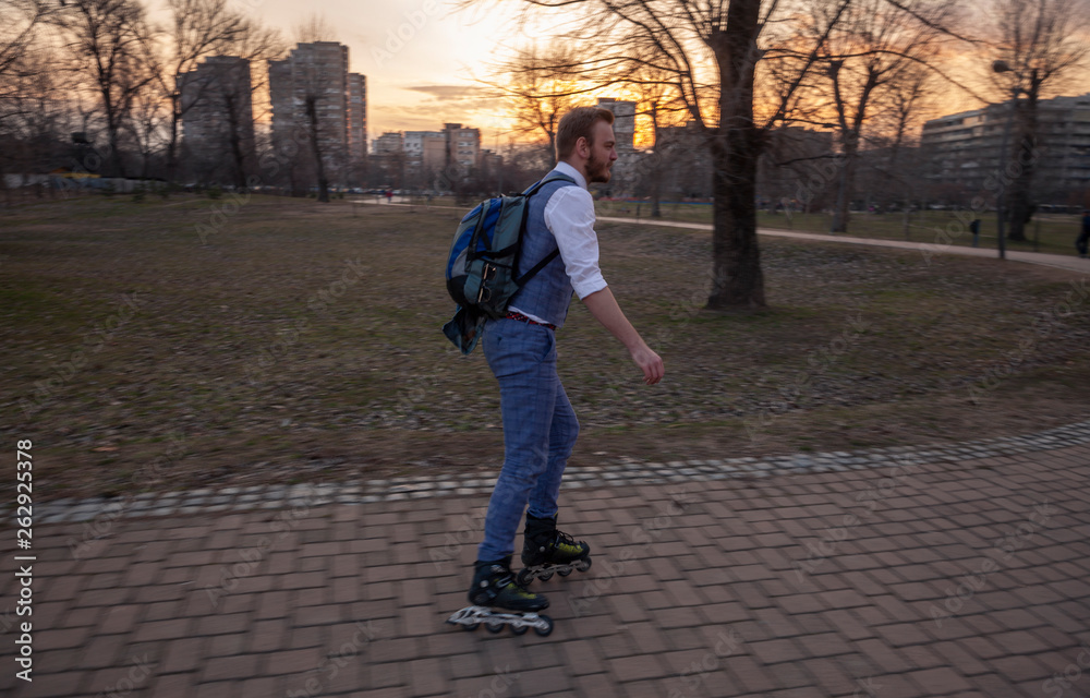 one young businessman ridding inline skates.