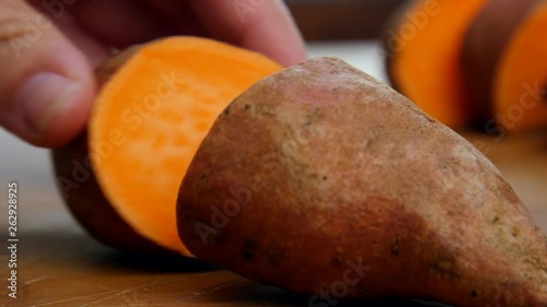 Cook slices open sweet potato. photo