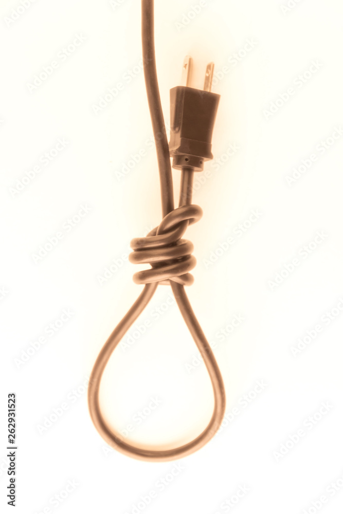 concept of energy dependence: a blurred silhouette of a hinge loop made of an electric cord with a plug, a toning, a haze concept of energy dependence: a blurred silhouette of a hinge loop made of an electric cord with a plug, a toning, a haze
