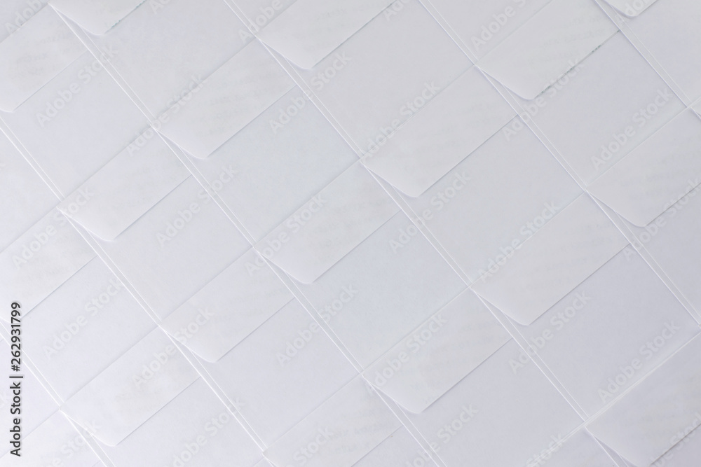 Fototapeta premium rows of blank white envelopes on desk in office, short focus, toning