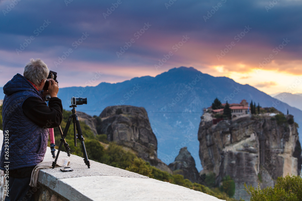 Man take photo from Meteora monastery