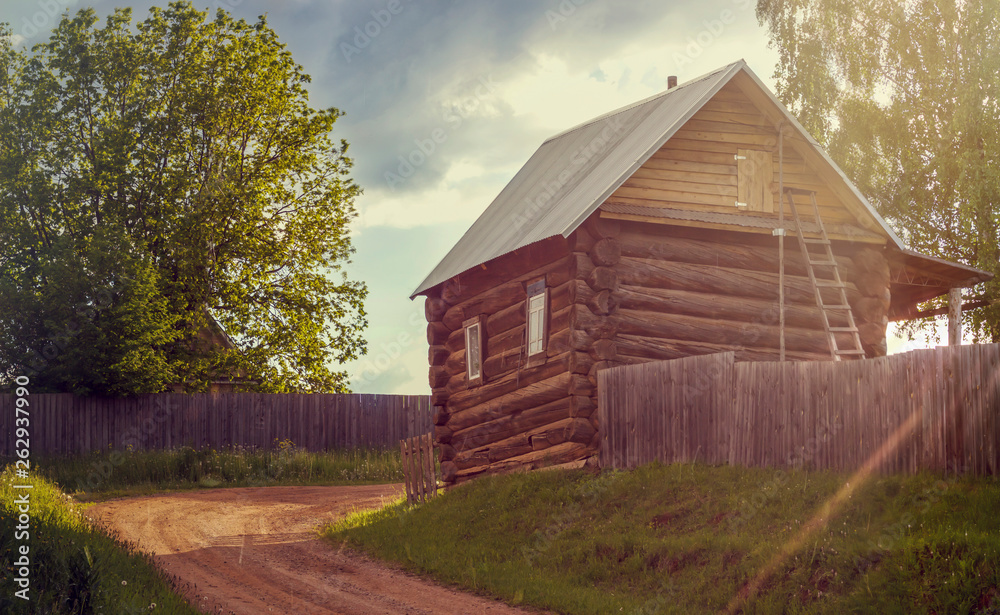Bright sunset is yellow - the sun, red with a lilac shade, in the remote village in a midland of Russia. Bright sunset is yellow - the sun, red with a lilac shade, in the remote village in a midland of Russia.