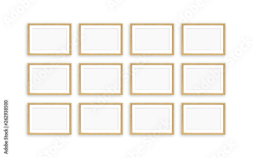 Golden frames collage, twelve blank realistic  frameworks isolated on white  wall