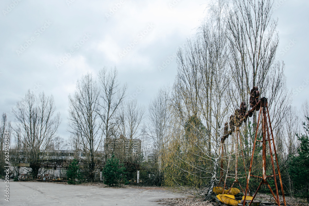 Abandoned carousel and abandoned ferris at an amusement park in the ...