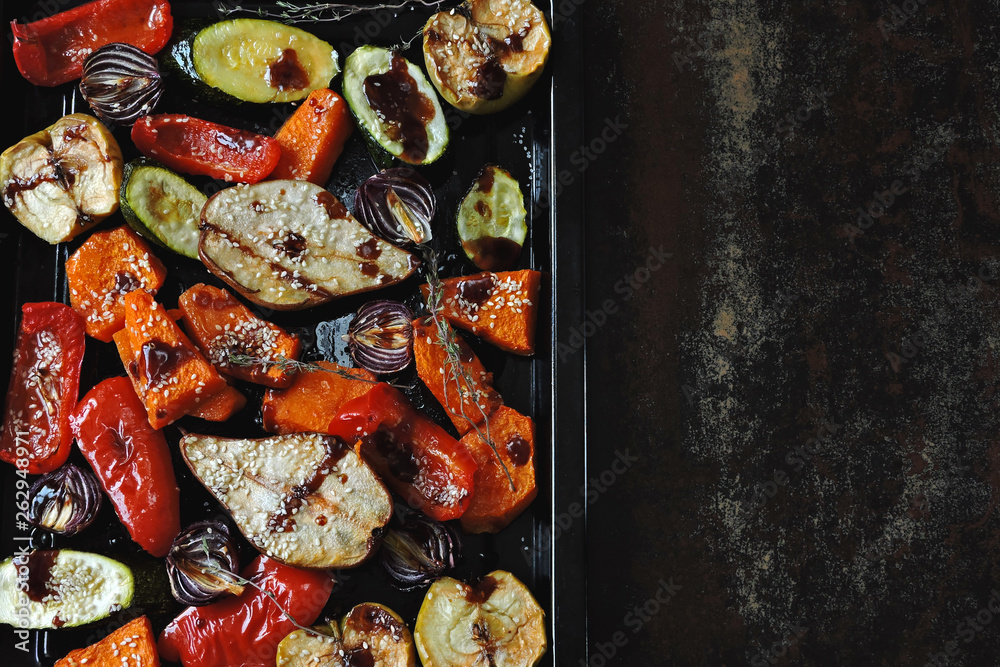Baked vegetables and fruits with sesame on the pan. Vegan food. Healthy diet. Baked vegetables and fruits with sesame on the pan. Vegan food. Healthy diet.