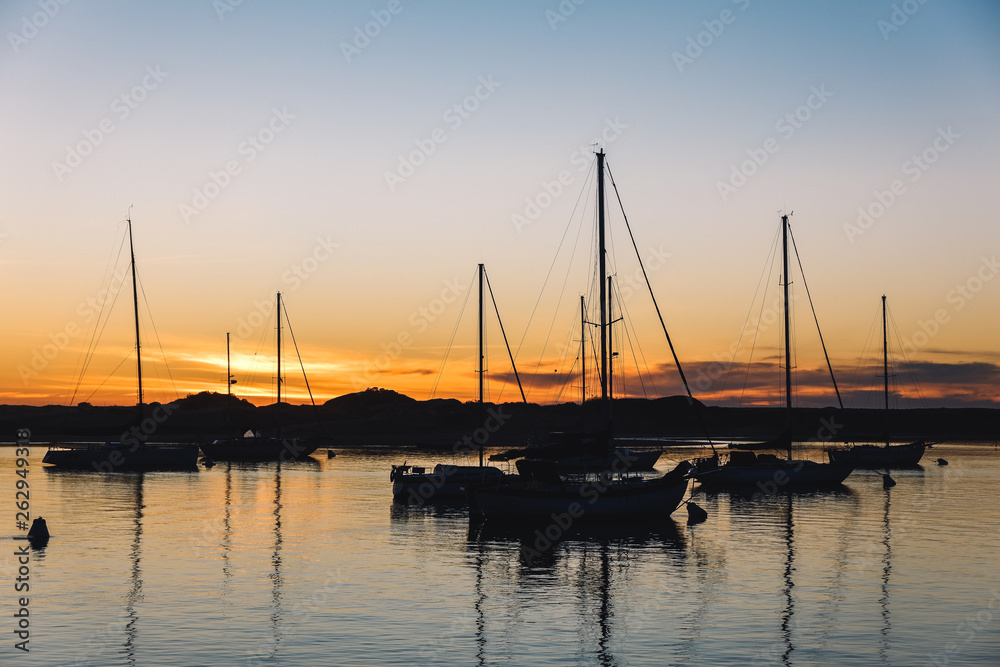 Sailing boat on the sea at sunset