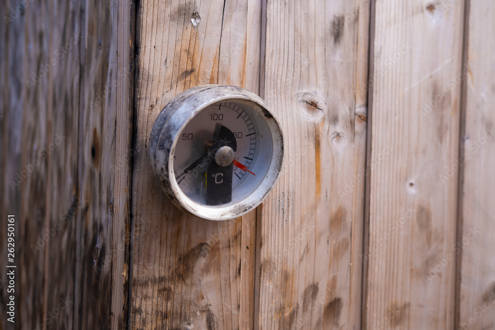 thermometer on wooden wall thermometer on wooden wall