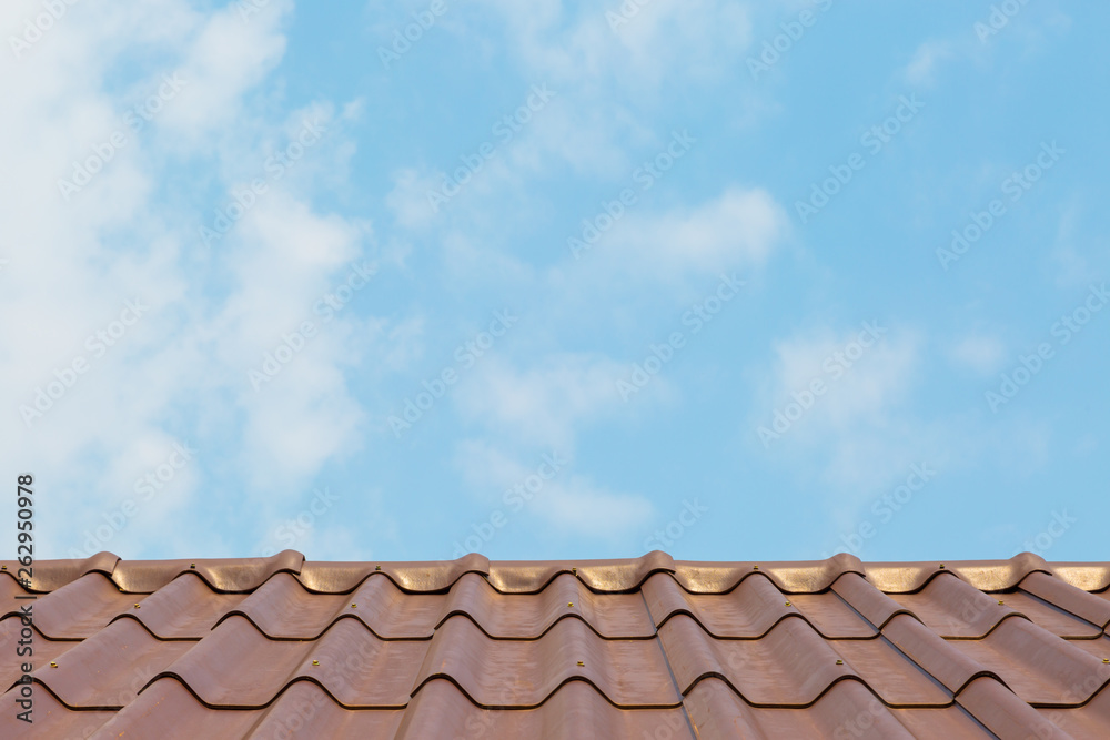 Roof house with tiled roof on blue sky. Roof house with tiled roof on blue sky.