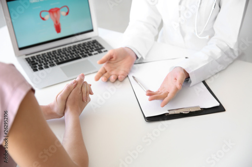 Gynecologist working with patient in office photo