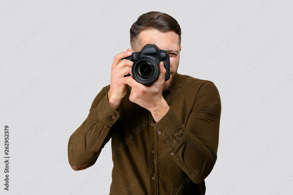Male photographer on light background Male photographer on light background