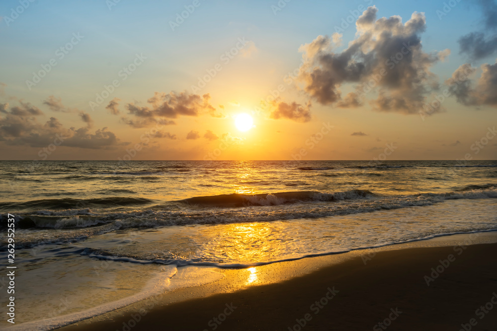 sunrise on the beach with soft wave.