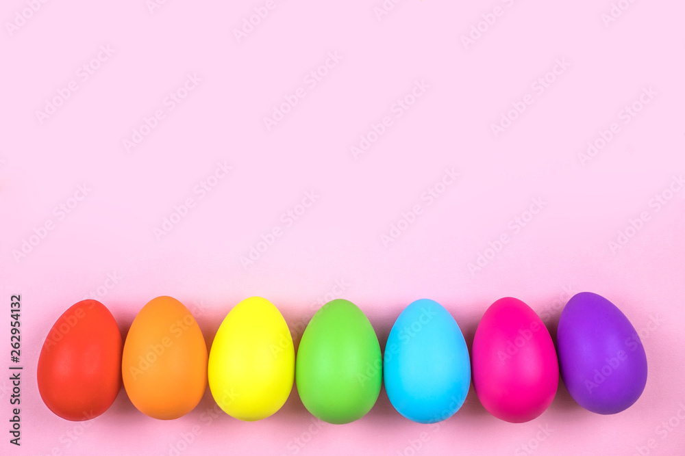 Colored Easter eggs on pink background. Flatlay. Colored Easter eggs on pink background. Flatlay.
