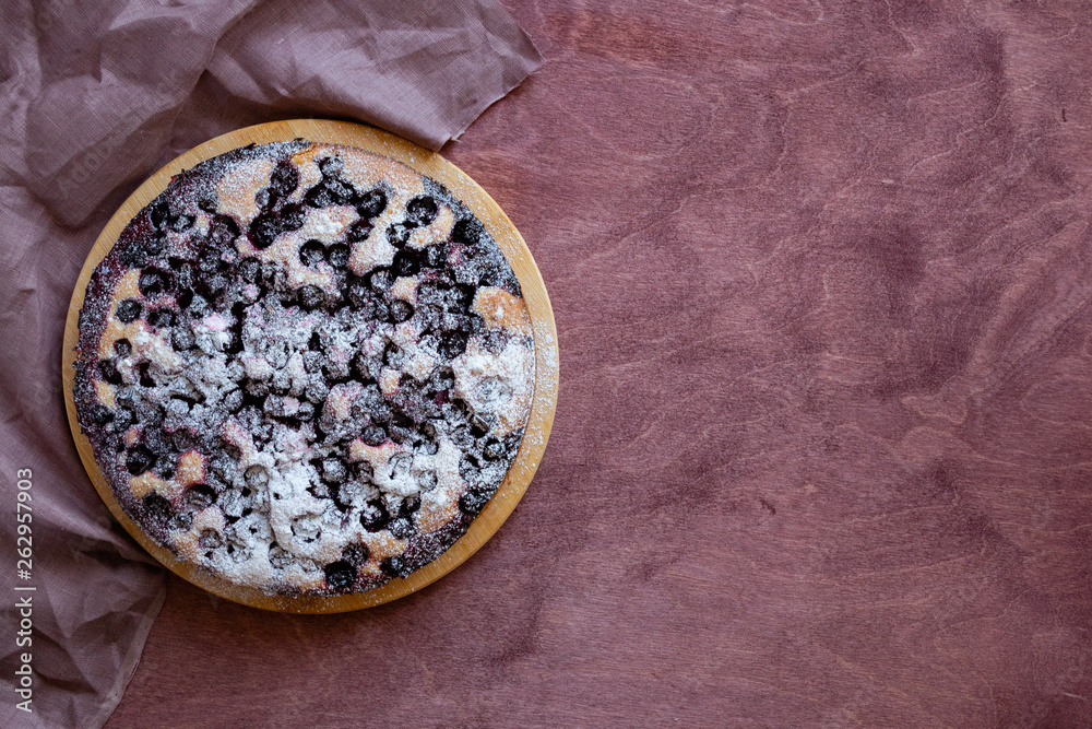 Homemade berry cake. Currant pie on wooden background. Rustik style. Free space for text. Homemade berry cake. Currant pie on wooden background. Rustik style. Free space for text.