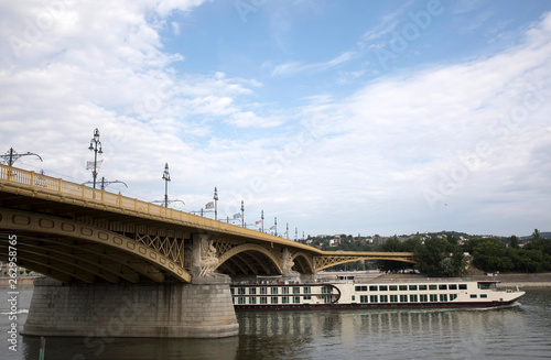 River boat and Bridge Danube River Budapest Hungary in Summer © Paul
