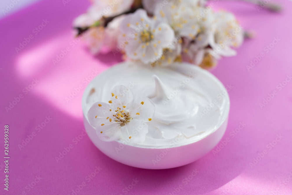 face cream and apricot flowers pink background face cream and apricot flowers pink background