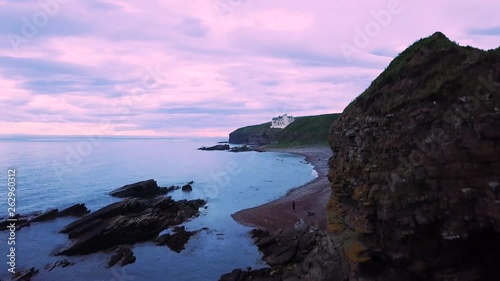 Castle in the Scottish Highlands at sunset - Dunbeath (Aerial Shot) photo