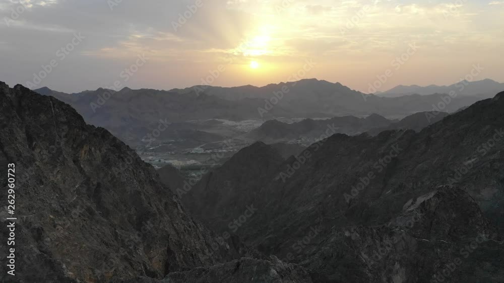Aerial view of an amazing endless mountain landscape sunrise. Adventures travel.