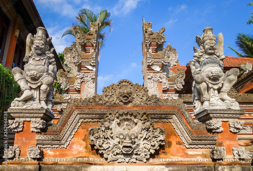 Fototapeta premium Statues on a temple entrance door, Ubud, Bali, Indonesia