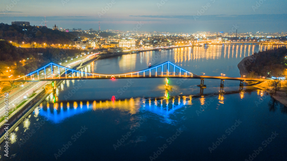 aerial night city view, luminous buildings and bridge.  Drone shot