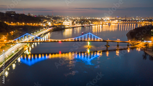 aerial night city view, luminous buildings and bridge.  Drone shot