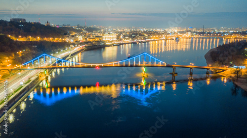 aerial night city view, luminous buildings and bridge. Drone shot
