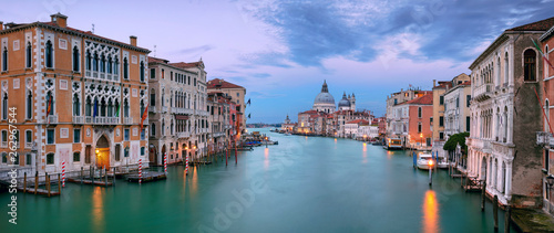 Venice, Italy. Panoramic cityscape image of Grand Canal in Venice, with Santa Maria della Salute Basilica in the background, during sunset © rudi1976