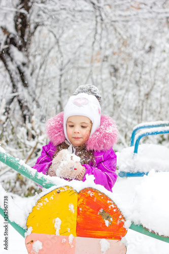 Little kid girl playing in ...