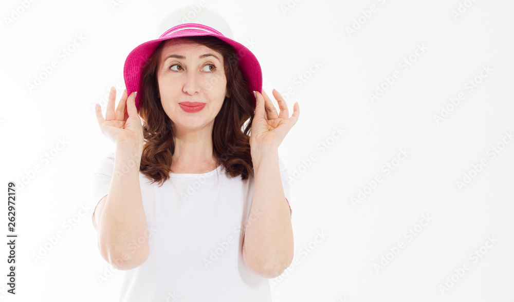 Anti wrinkle aging summer face skin protection. Middle age woman in beach hat and makeup in white template t shirt isolated. Holiday and vacation concept. Copy space background. Banner Anti wrinkle aging summer face skin protection. Middle age woman in beach hat and makeup in white template t shirt isolated. Holiday and vacation concept. Copy space background. Banner