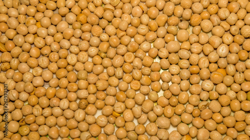 Close up pile of yellow gram flour beans texture, background pattern. Natural grains and cereals. Agricultural product concept. Seamless colorful canvas. Studio shot. Copy space room for text.Top view