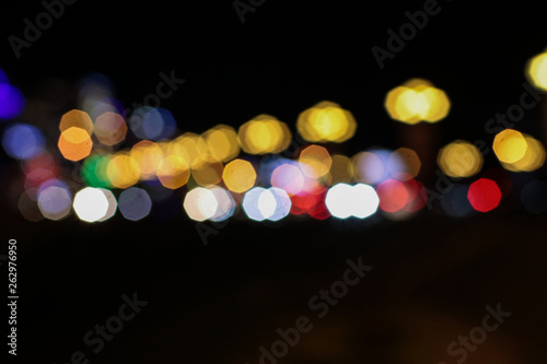 Abstract light celebration background with defocused golden lights for Christmas, New Year, Holiday, party © Warunporn