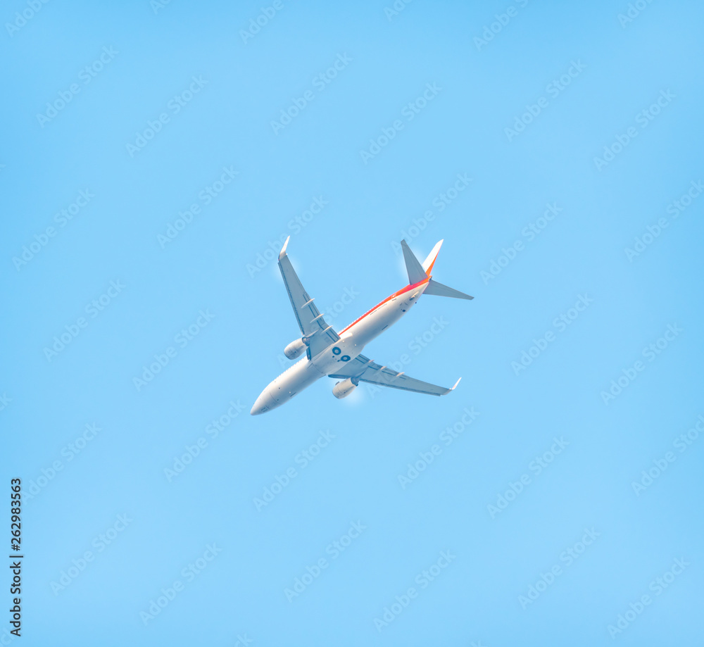 A plane flying in the sky. A plane flying in the sky.