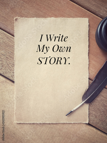 Motivational and inspirational wording - I Write My Own Story written on a paper.