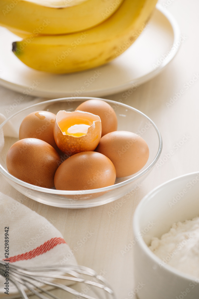 ingredients and tools to make a cake, flour, butter, sugar,eggs ingredients and tools to make a cake, flour, butter, sugar,eggs