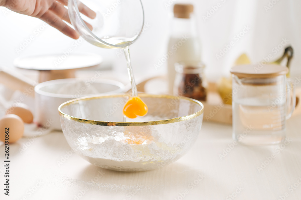fresh eggs milk and flour on white table fresh eggs milk and flour on white table