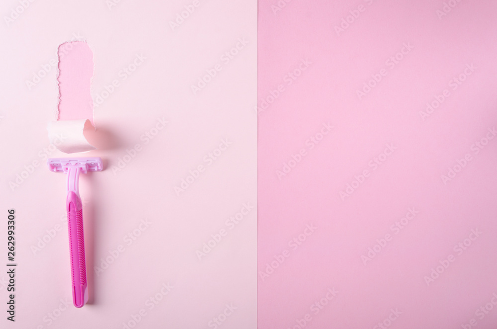 Torn paper after using razor for women.Concept of beauty treatments with depilation tools Torn paper after using razor for women.Concept of beauty treatments with depilation tools