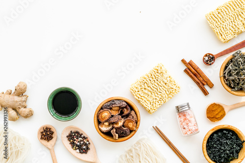 Rice vermicelli, noodles, spices, weeds pattern to cook Chinese, Japanese food on white background top view copy space photo